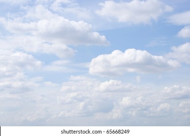 White Sky And Puffy Clouds