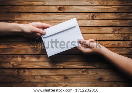 Similar – Image, Stock Photo Child holding two snail shells in her hand
