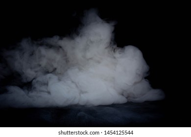 
White smoke in the air On a black background There is space to put various text.