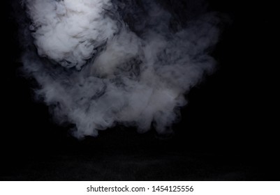   White smoke in the air On a black background There is space to put various text.