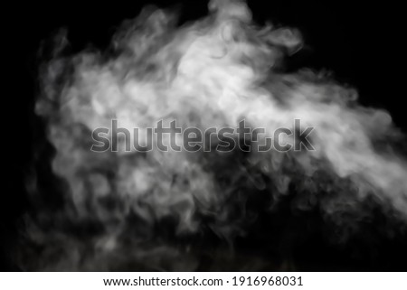 White smoke glow in the dark, steam gushing to form free shapes, beautiful abstract abstraction on black background, used for background.