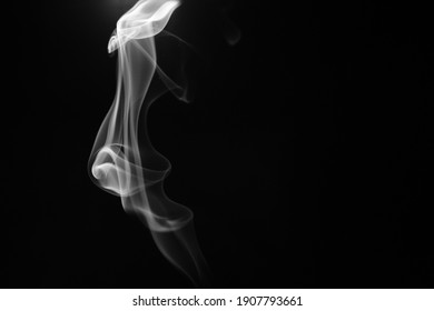 white smoke on black background creating art forms and textures