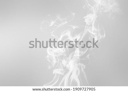 White smoke on silver grey background. Smoking or nonsmoking healthcare concept