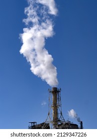 White Smoke Rising From The Factory Chimney