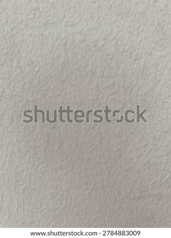 white, smooth, and seemingly ribbed, flat wall.