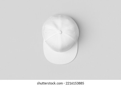 White snapback cap mockup on a grey background. - Shutterstock ID 2216153885