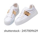 White sneaker isolated. Close-up of a pair white elegant stylish female leather high-heeled sport shoes isolated. Womens shoe fashion. Modern footwear for workout.