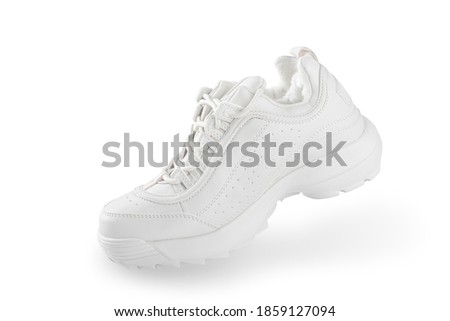 White sneaker. One White sneaker isolated on white background. simulation of the walking process. in motion. sport shoe concept