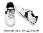 White sneakers isolated. Close-up of a pair white elegant stylish leather sport shoes isolated on a white background. Clipping path. Kids shoe fashion. Modern design footwear for workout. Macro.