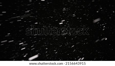 White snow falling against dark background 60fps footage