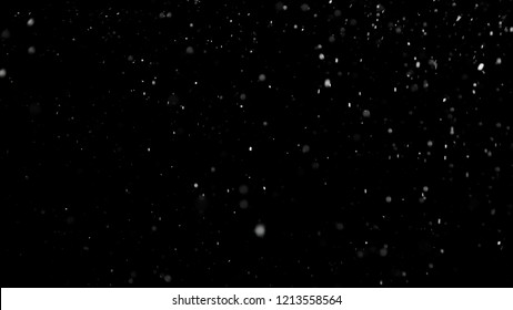 White Snow Falling On Isolated Black Background, Shot Of Flying Snowflakes Bokeh, Dust Particles Or Powder In The Air. Holiday Overlay Effect