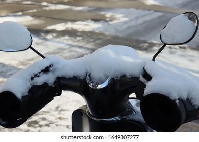 White Snow On The Motorcycle Side Mirror
