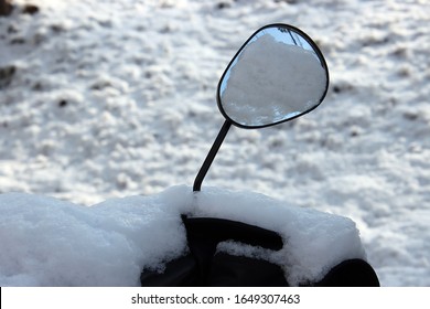 White Snow On The Motorcycle Side Mirror
