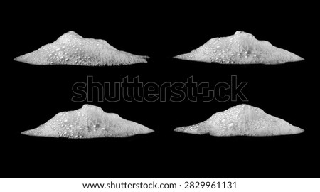 White soap foam bubbles isolated on black background. Abstract cleaning texture with soft detergent lather for hygiene, washing, skincare, sanitation and cosmetic design concepts.