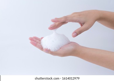 White Soapy Foam Bubbles Texture On Woman Hand