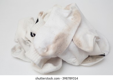The white socks have also stains do not wash on white background