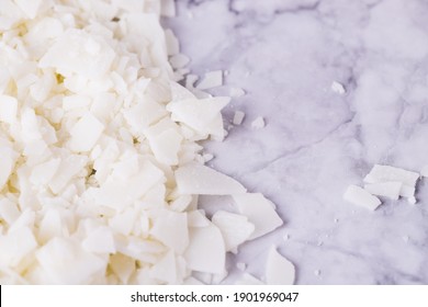 White Soy Wax Flakes For Candle Making On A Gray Marble Background