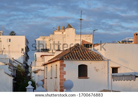 White spanish houses in old town of Andalusia with roof tiles in