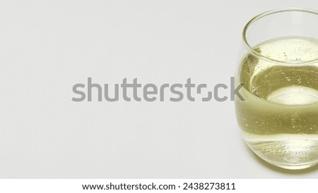 White sparkling wine in round glass