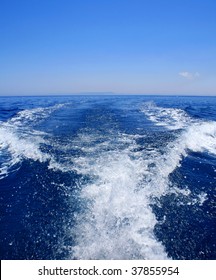 White Speedboat Wake On Blue Sea