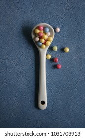White spoon with decorative elements. Minimal concept. 