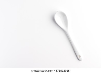 White spoon isolated on a white surface