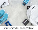 White sport backpack with sneakers and bottle of water. Flatlay, top view.