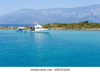 
White Sport Fishing Yacht, 
White Sport Fishing Boat, White Sport Fishing Boat Passing Through Sedir Island In The Aegean Sea.
