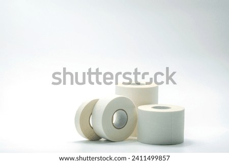 White sport tape isolated on white background. Athletic taping. Porous adhesive tape. Medical tape. Multipurpose porous tape for wound care and sprain. First aid medical supplies. Sport bandage.
