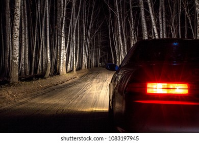 White Sports Car On A Country Road, In A Night Birch Forest