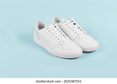 White Sports sneakers on a blue background