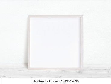 White Square Frame Image Mockup. White Background And White Desk.