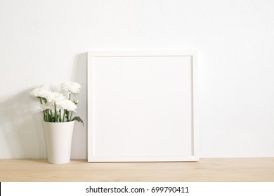 White Square Frame Photo With Flower In Vase On Table.home Decoration