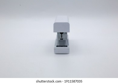 A White Stapler On A White Table