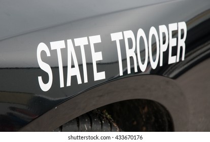 White state trooper -decal on a black law enforcement vehicle - Shutterstock ID 433670176