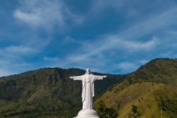 A White Statue Of Jesus Christ With A View Of The Hills Behind It, Located On Sibea-bea Hill, Lake Toba, North Sumatra, Indonesia.