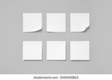 white sticky note isolated on grey background.