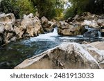 The white stone formations along the banks of the Pas River near Puente Viesgo in Cantabria, Spain.