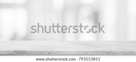 White stone marble table top and blurred abstract background from interior building banner background - can used for display or montage your products.