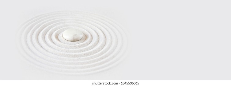 White stone in the sand. Zen japanese garden background scene. Horizontal banner