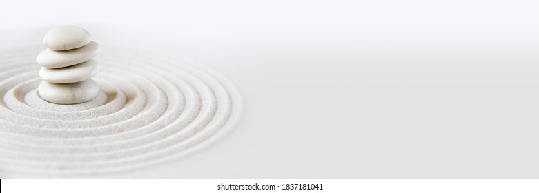 White stones pile in the sand. Zen japanese garden background scene. Horizontal banner