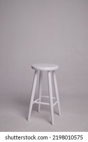 White stool with shadow on white background. Location in studio for photoshoot with tabouret on white background