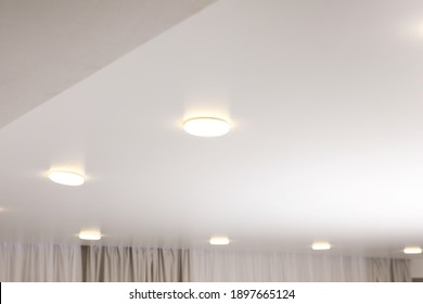 White Stretch Ceiling With Spot Lights In Room