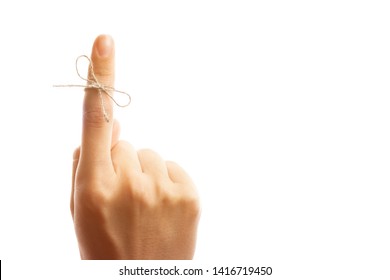 White String Tied Around A Finger