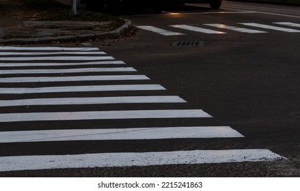 White stripes of pedestrian crossing. Focus at the center of image - Shutterstock ID 2215241863