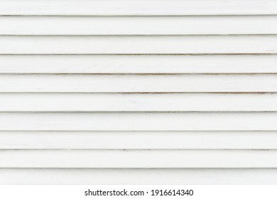 White stripes texture. Stripped wooden background. Bright window shutters closeup. Lines pattern. Horizontal stripes backdrop.