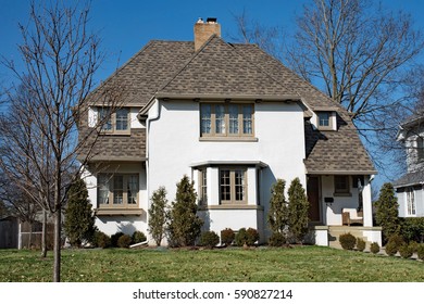 White Stucco Home With Hip Roof