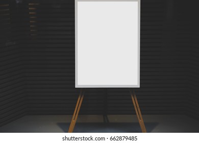White stylish chalkboard with mock up copy space are for your text message or advertising promotional content, empty presentation wooden board standing on the glass storefront