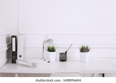 White And Stylish Home Interior With Cool Office Accessories, Notes, Boxes, Pencils And Air Plant
