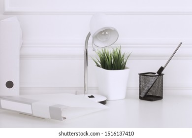 White And Stylish Home Interior With Cool Office Accessories, Notes, Boxes, Pencils And Air Plant
